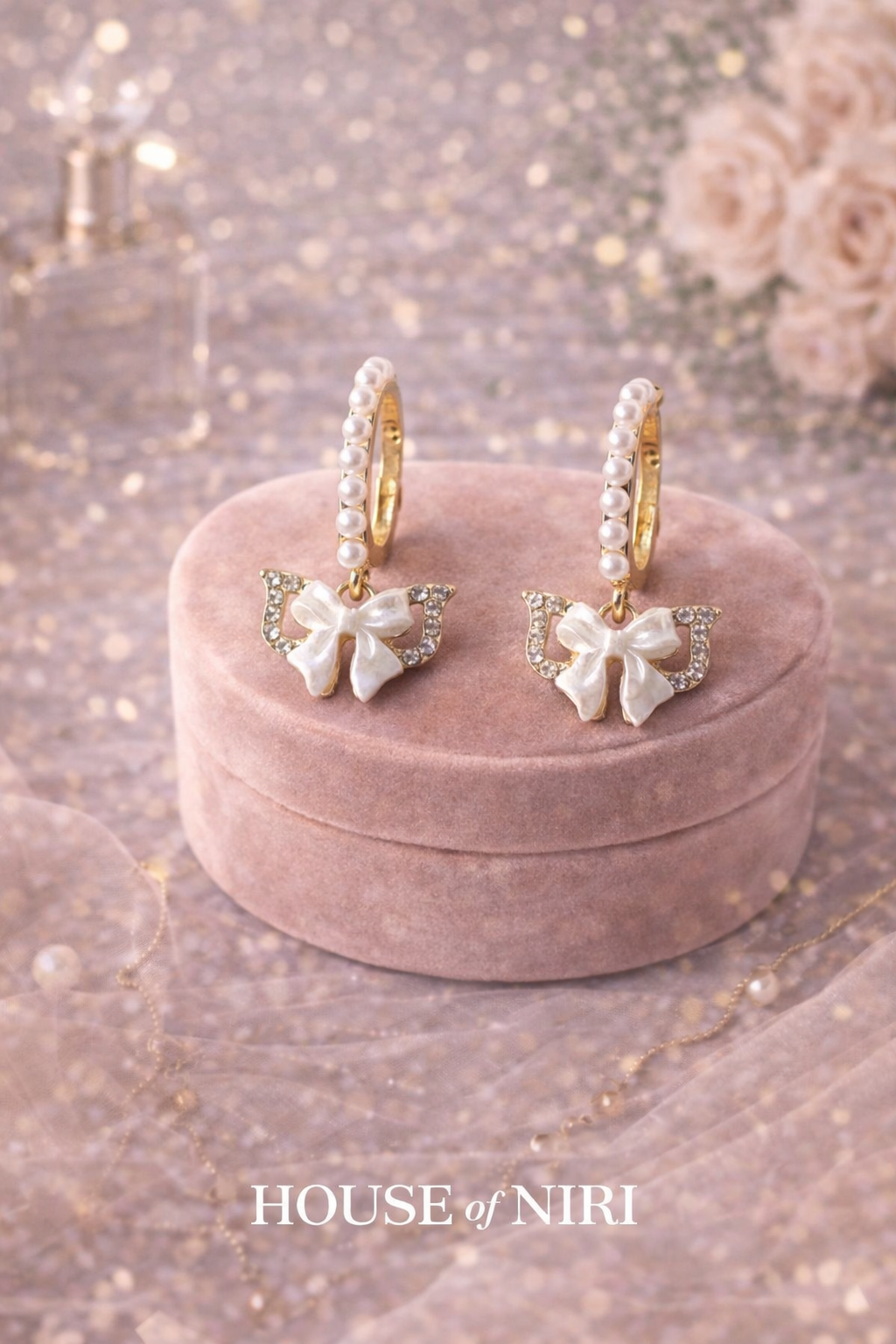 The Amara Bow Pearl Hoops